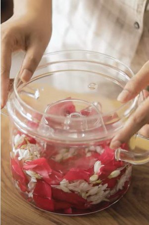 how to make jasmine and rose water for super shiny hair, Adding a smaller bowl