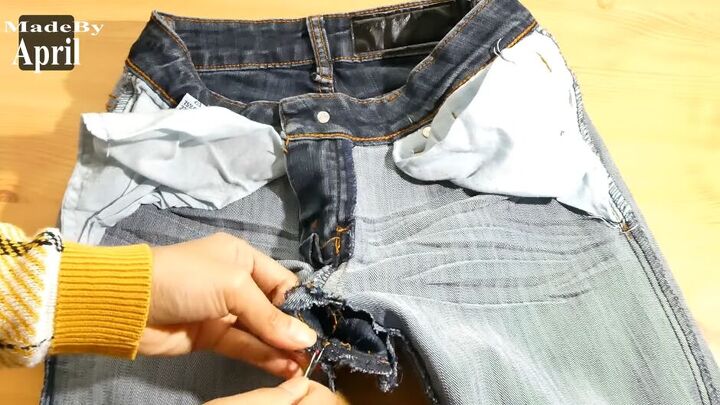 how to upcycle low waisted jeans into high waisted jeans, Ripping the inner legs