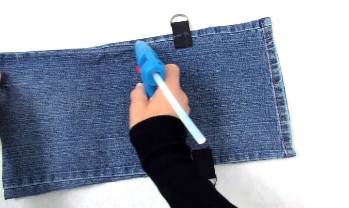 how to make a purse out of jeans in 4 super cute and easy ways, Gluing the sides of DIY denim purse
