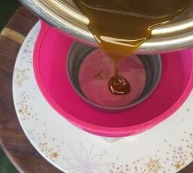 get long shiny hair with this super easy hair oil recipe, Pouring mixture into a jar