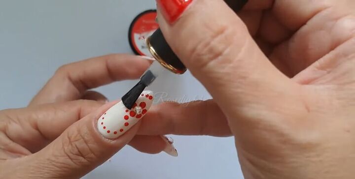nail art tutorial cute and easy red flower nails, Applying topcoat