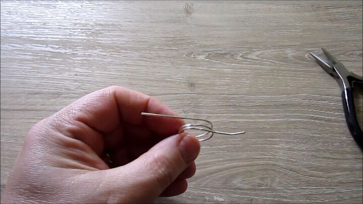 beginner friendly jewelry tutorial how to make a wire wrapped ring, Removing the mandrel