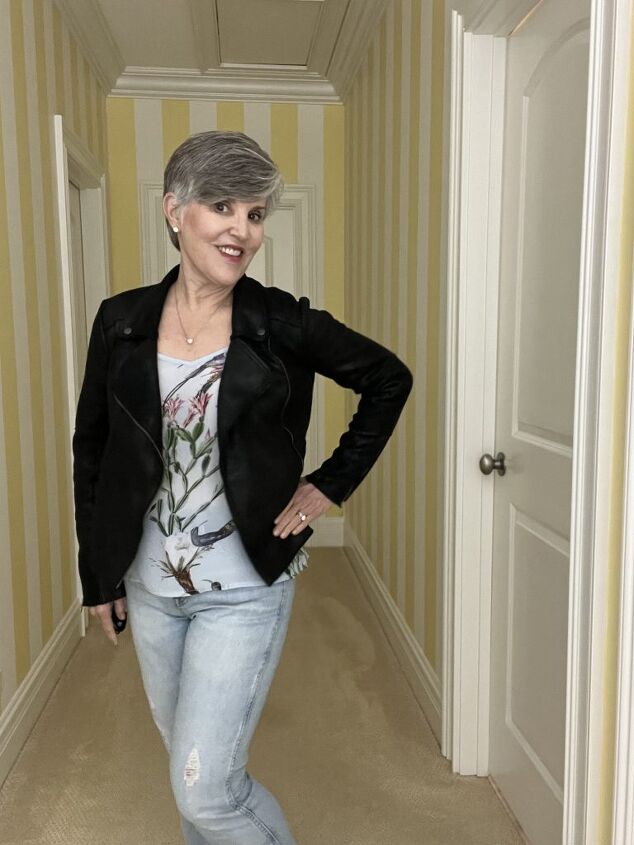 three casual date night outfits, In this third casual date night look I paired a satiny pale blue camisole with a black faux moto jacket and distressed jeans I added a pave silver heart necklace to fill in the neckline
