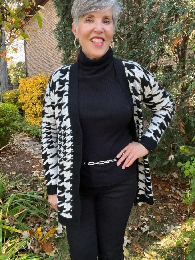 how to style a houndstooth cardigan four ways, Here is the black and white houndstooth cardigan with a black ribbed turtleneck black jeans black booties and a dainty silver chain link belt