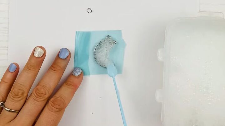 how to create a gorgeous resin moon charm using regular dish soap, Adding bubbles to the charm