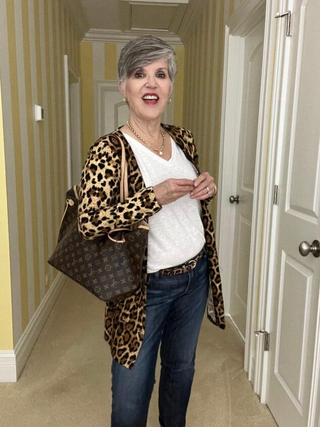what to wear for thanksgiving, In this elegant Thanksgiving day outfit I am wearing a very light weight leopard cardigan over medium wash jeans with nude D orsay pumps My necklace is a great gold link necklace by Evereve with a central pearl I am also wearing hoop earrings and a white tee