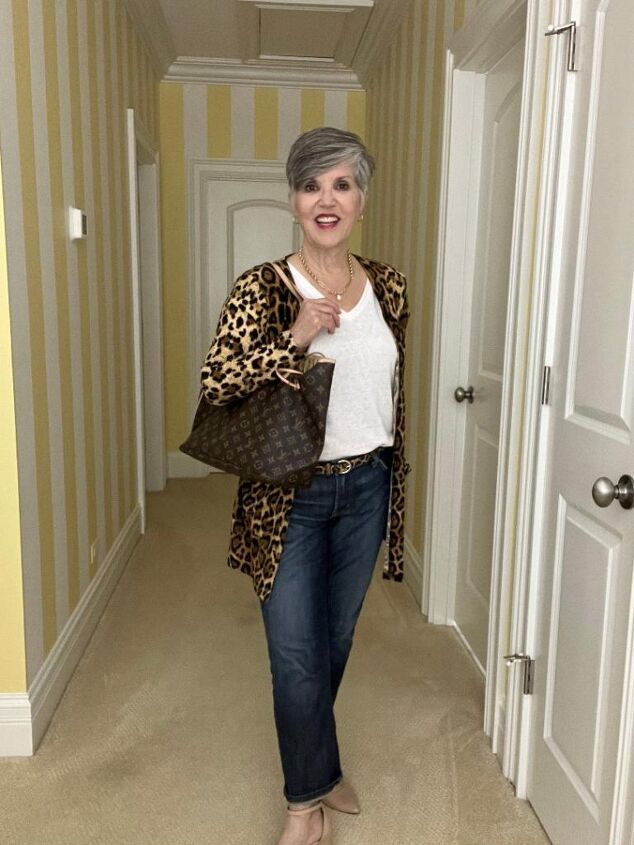 what to wear for thanksgiving, In this elegant Thanksgiving day outfit I am wearing a very light weight leopard cardigan over medium wash jeans with nude D orsay pumps My necklace is a great gold link necklace by Evereve with a central pearl I am also wearing hoop earrings and a white tee This photo is a full view