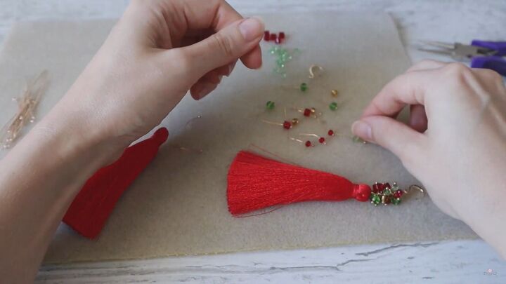 how to create a pair of gorgeous christmas earrings, Placing each crystal on its own pin