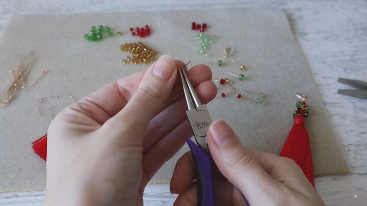 how to create a pair of gorgeous christmas earrings, Bending each pin in place