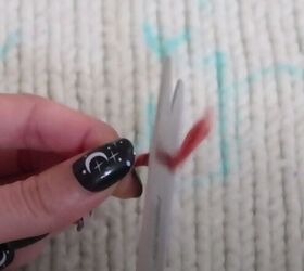 embroidery tutorial how to personalize your favorite knit sweater, Snipping yarn tip
