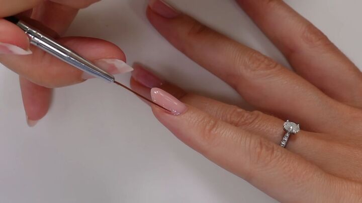 save a fortune with this diy gel nails tutorial, Pulling polish with striping brush