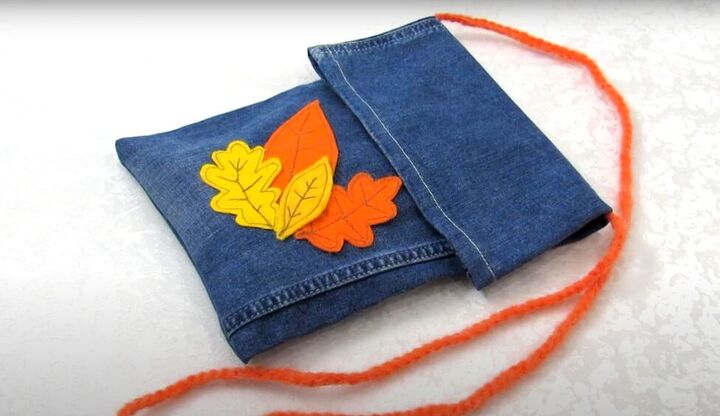 how to diy a fun crossbody bag from old jeans, Completed DIY jean crossbody bag