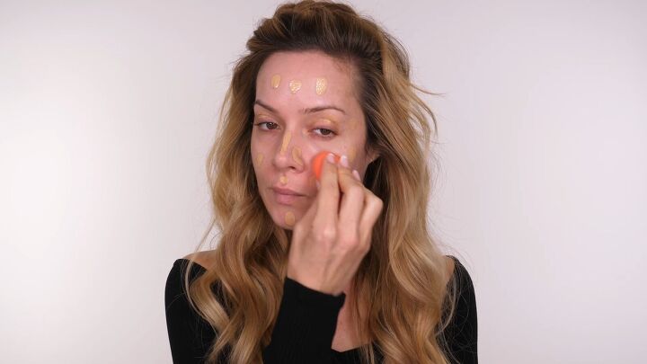 wow with this glam holiday party eye makeup, Applying foundation