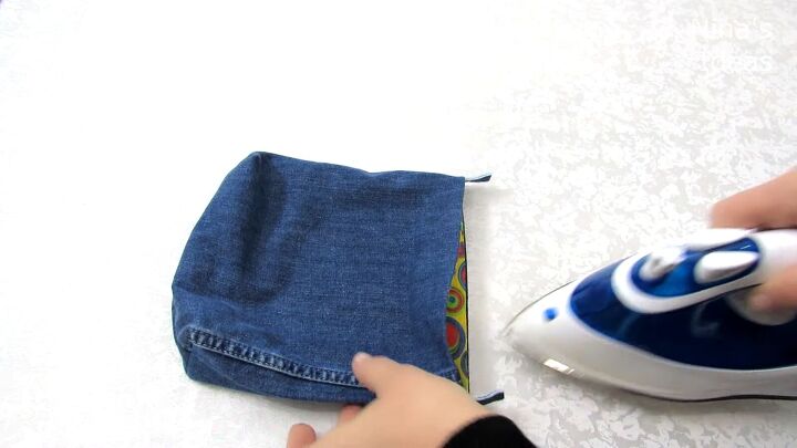 how to diy a cute jean purse from old jeans, Ironing the DIY jean purse
