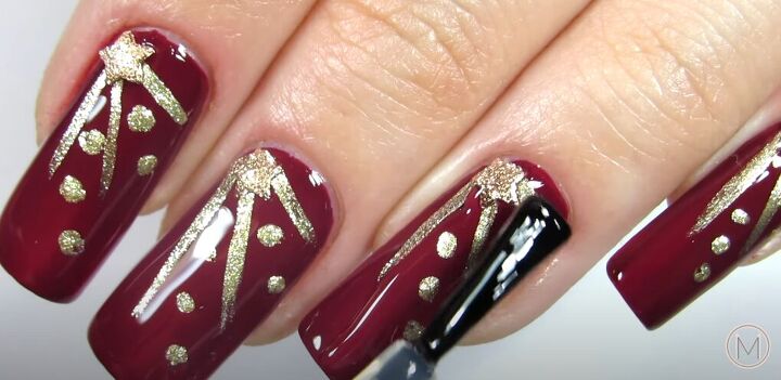 how to diy glam christmas star nails for the holidays, Applying a topcoat