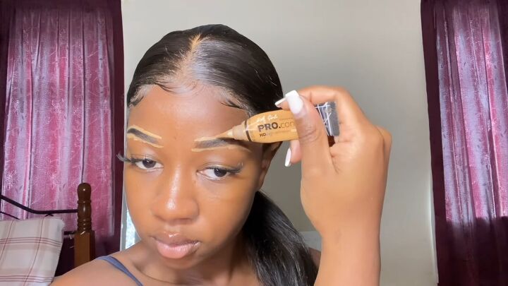 super easy clean girl makeup tutorial, Applying concealer to brows