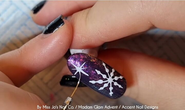 how to create a festive snowflake nail design in 8 easy steps, Drawing a star