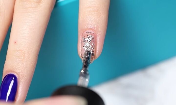 how to diy confetti nails for new year s eve, Applying glittery nail polish