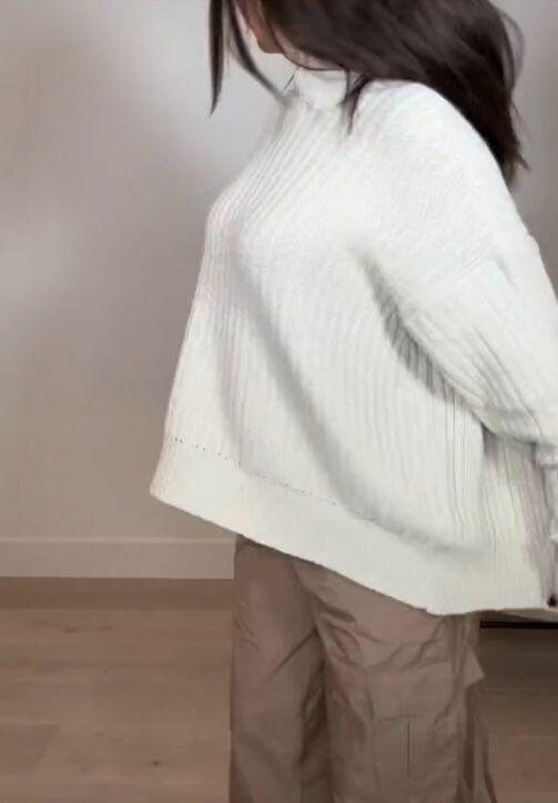the surprising way to wear an oversized cardigan, Putting cardigan on backward