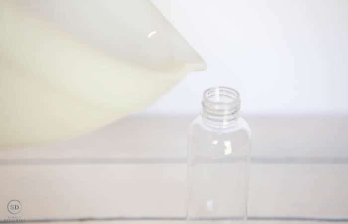 how to make hand sanitizer, pour hand sanitizer into a pump bottle