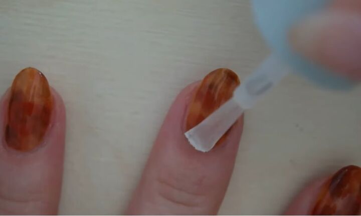 how to diy a cute tortoise shell nail design, Applying a top coat