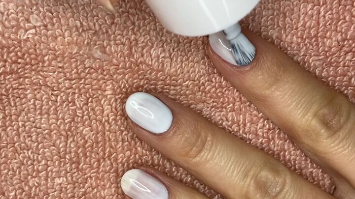 how to do an easy reverse half moon french manicure, Painting nails with a light colored polish