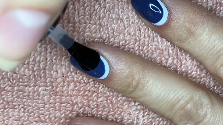 how to do an easy reverse half moon french manicure, Applying a clear top coat to nails