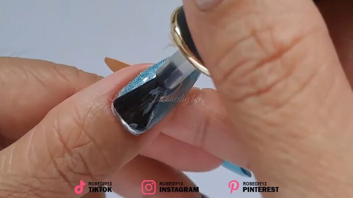 how to diy these awesome gel sea blue nails, Appling top coat