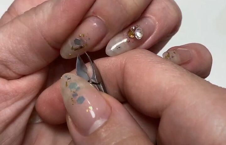 simple nails refresh tutorial how to make your manicure last longer, Removing damaged nail jewels