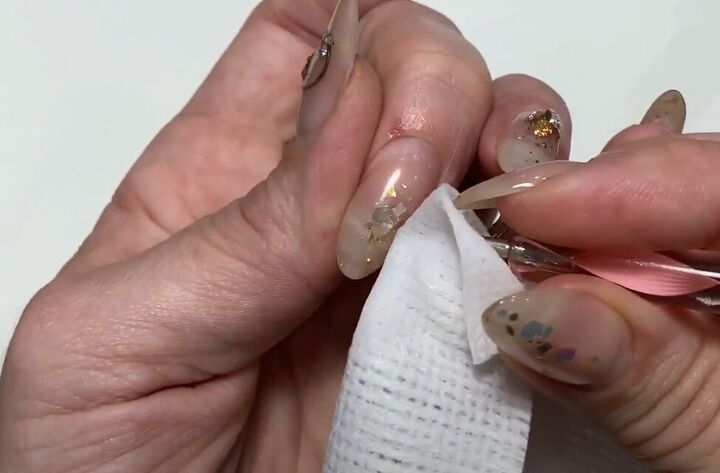simple nails refresh tutorial how to make your manicure last longer, Removing damaged nail jewels