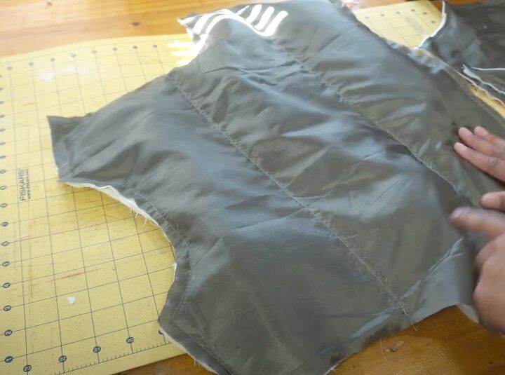 how to diy a cute and cozy cropped puffer vest, Adding padding