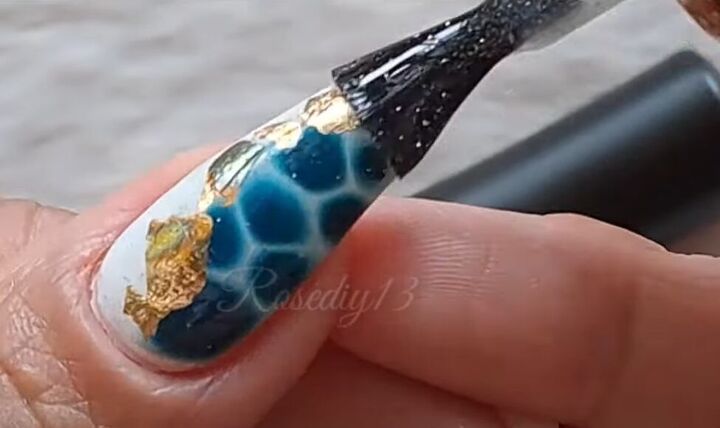 how to diy cute blue and gold tortoiseshell nails, Applying top coat