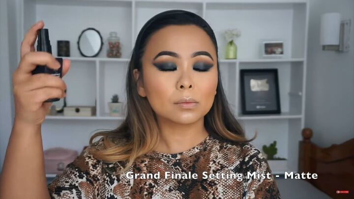 glam smokey cat eye makeup tutorial, Spraying setting mist