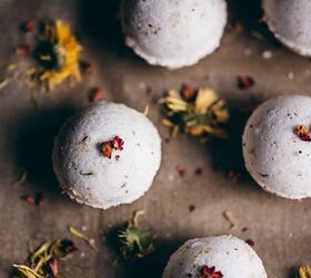 diy fizzy calendula rose bath bombs, homemade bath bombs rest with a sprinkle of dried crushed rose petals on top