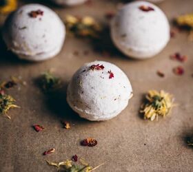 diy fizzy calendula rose bath bombs, a white bath bomb sprinkled with rose petals