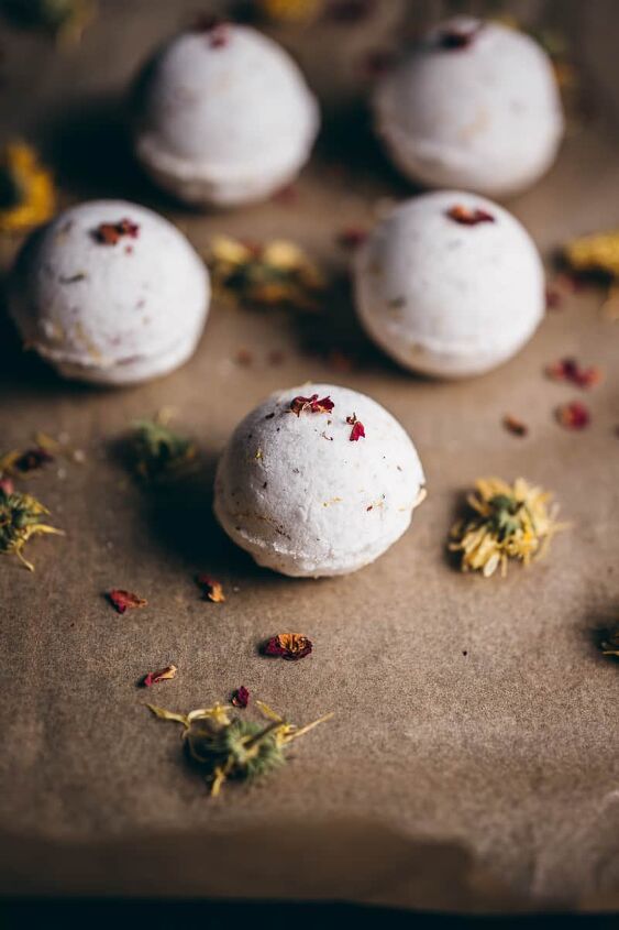 diy fizzy calendula rose bath bombs, a white bath bomb sprinkled with rose petals