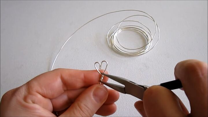 valentine s diy how to make a super cute wire heart ring, Pushing coils together
