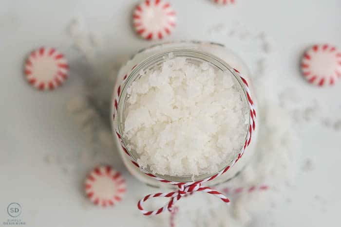 peppermint sugar scrub, photos of peppermint sugar scrub looking straight down on it in a jar surrounded by red and white peppermint candies