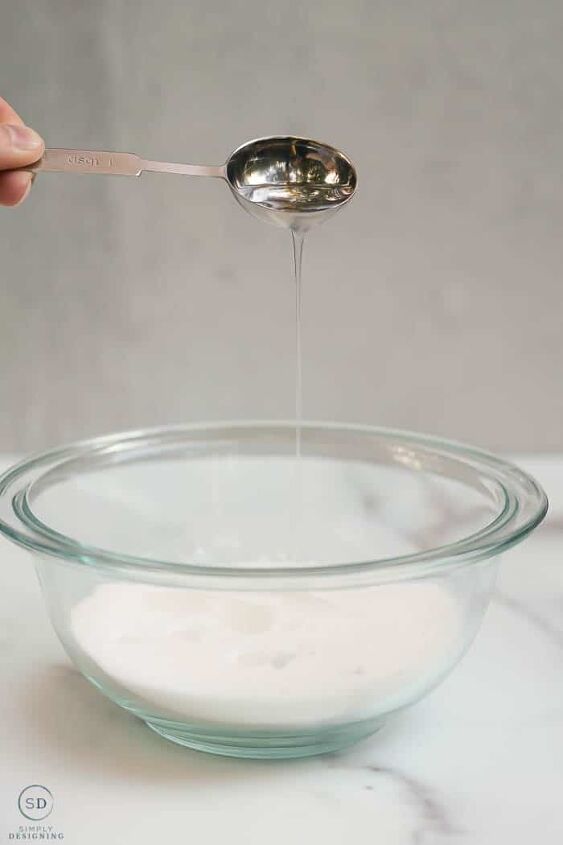 peppermint sugar scrub, pouring fractionated coconut oil into sugar for a sugar scrub