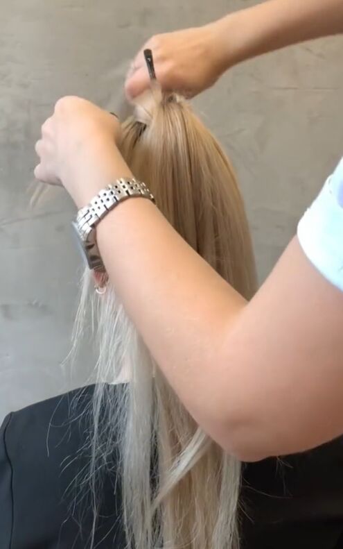 wow you ve never seen a ponytail hack like this, Draping hair around paintbrush