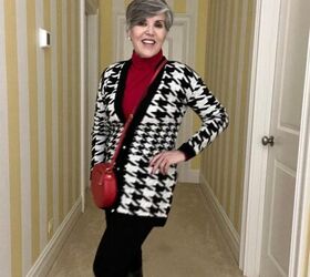 what i wore to nyc in december, I am wearing a black and white houndstooth cardigan over a red turtleneck with black leggings black boots and a red crossbody bag