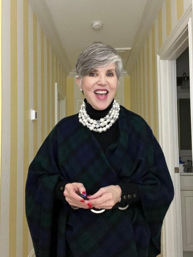 what i wore to nyc in december, Here I am wearing a black ribbed turtleneck with black velvet jeans a black watch plaid poncho and a pearl choker