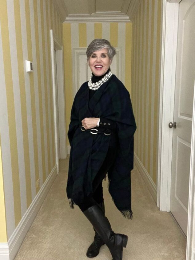 what i wore to nyc in december, I am again in the black watch poncho but you can see how I belted just the front of it with a black and silver belt This is a total view where you can also see my black riding boots
