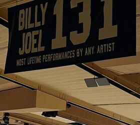 what i wore to nyc in december, This is a photo of a banner stating that Billy Joel has had the most lifetime performances by any artist