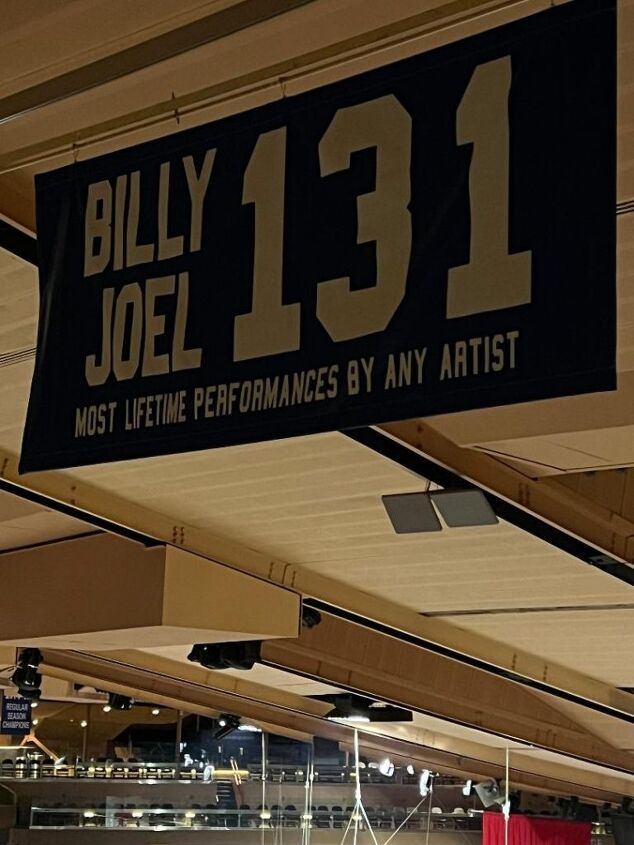 what i wore to nyc in december, This is a photo of a banner stating that Billy Joel has had the most lifetime performances by any artist