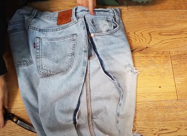 how to diy custom fitted ripped jeans, Opening the side seams