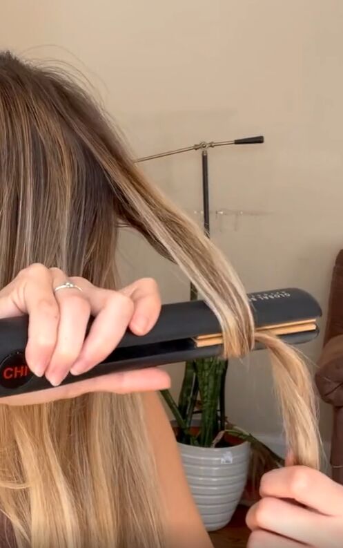 genius tiktok hair straightener hacks, Wrapping hair around straightener