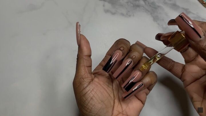 how to diy a sexy nude and black nail design, Applying cuticle oil