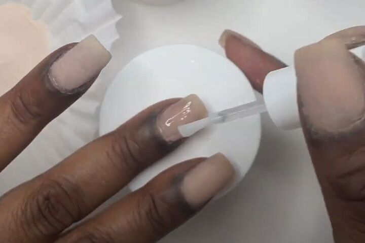 how to diy super cute nude nails with swirls, Adding second coat