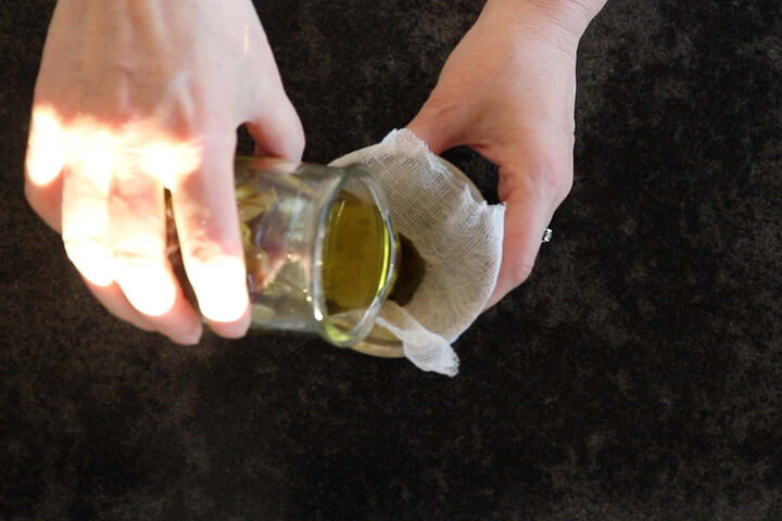 how to make aloe vera oil 3 ways, straining aloe vera leaves out of aloe vera infused oil